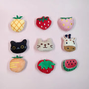 Colorful Soft Plush Pet Sports Balls Toy Set shaped like fruits and animals on a light pink background