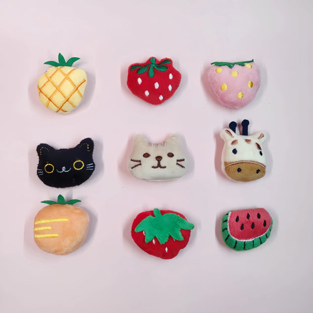 Colorful Soft Plush Pet Sports Balls Toy Set shaped like fruits and animals on a light pink background