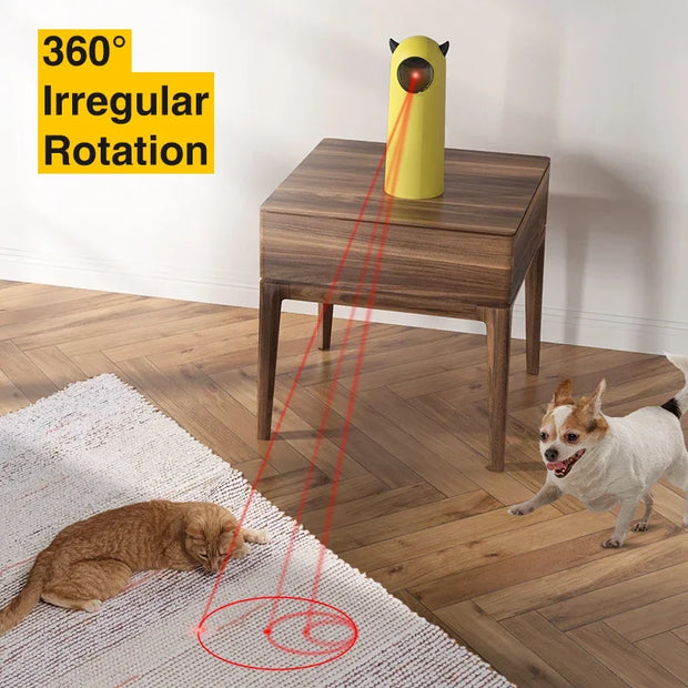 Yellow Little Devil Automatic Infrared LED Laser Cat Toy laser pointer on a table with red beams pointing at a cat and dog, labeled '360° Irregular Rotation'.
