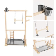 Wooden Bird Play Stand with metal platforms and cups on a white background