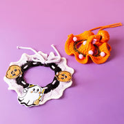 Two Pet Halloween Knitted Collar ties on a purple background