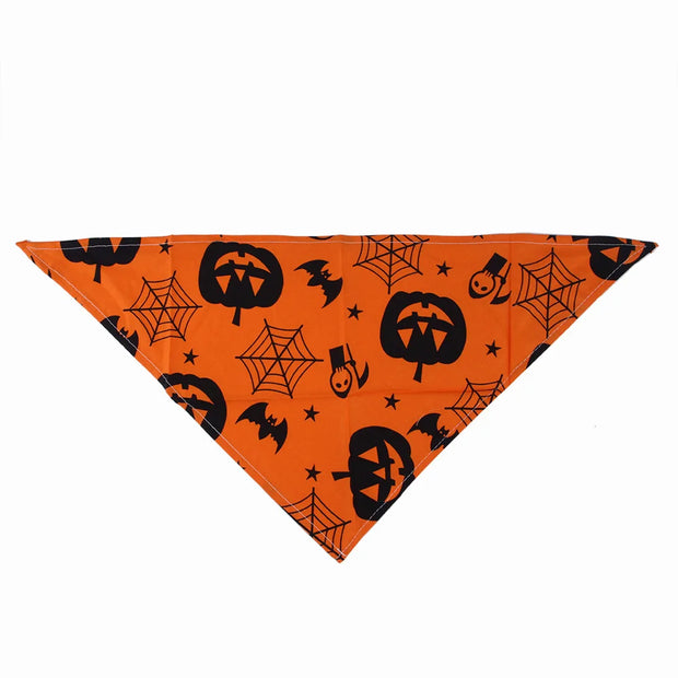Halloween Pet Hat And Drool Towel Set with pumpkins, bats, and spider webs on an orange background.