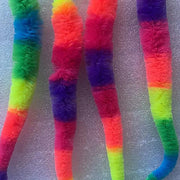 Colorful Rainbow Tail Cat Toy Balls in rainbow pattern on a textured gray background