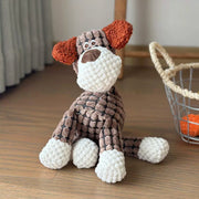 Knitted Plush Animal Rope Dog Toys on a wooden floor with a basket in the background