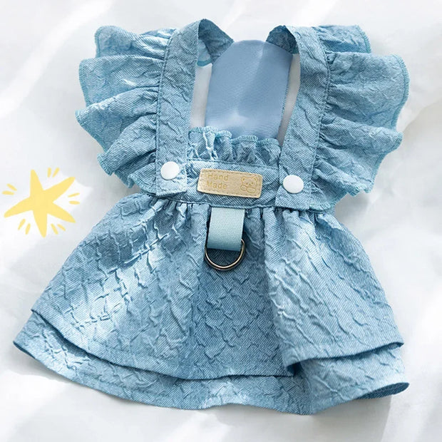 Blue textured Denim Dog Dress with ruffled straps on a white background