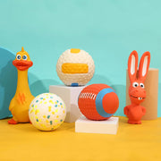 Colorful Durable Dog Sports Balls  including a duck, rabbit, and various balls on a yellow and blue background