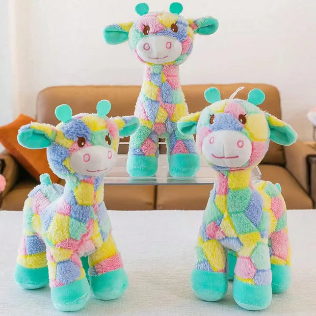 Three Plush Giraffe Dog Toy on a table with a blurred background