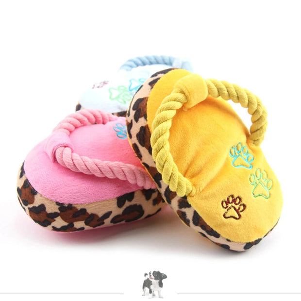 Two Plush Slipper Dog Toy with leopard print and paw designs on a white background.
