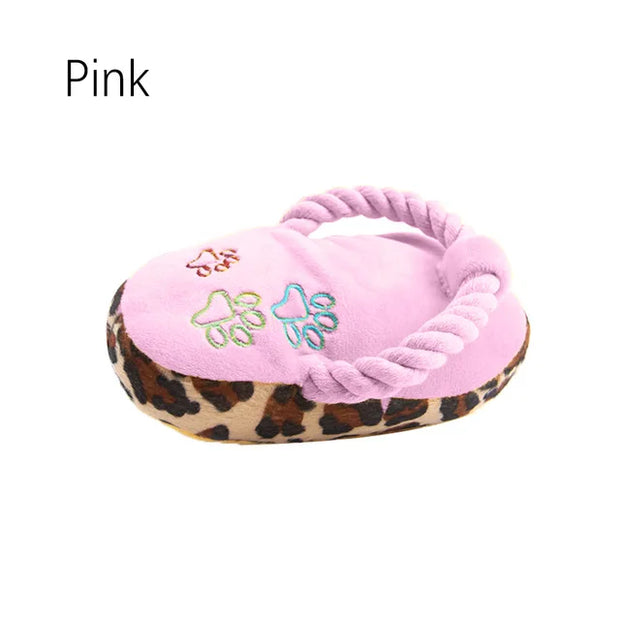 Pink Plush Slipper Dog Toy with leopard print base on a white background